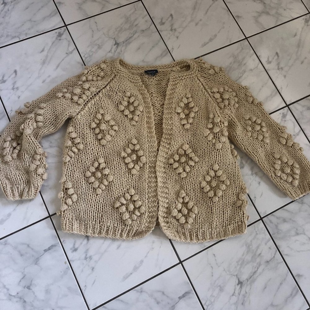Gorgeous pom pom like open sweater
